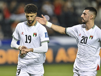 Wessam Abouli (L) of Palestine celebrates after scoring a goal during the FIFA World Cup 2026 Qualification 3rd Round group B match between...