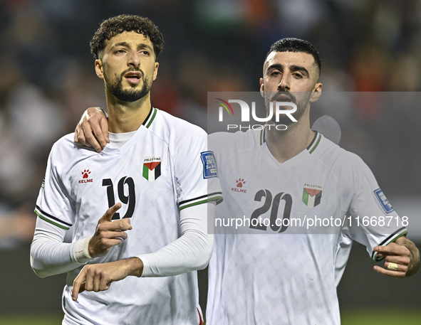 Wessam Abouli (L) of Palestine celebrates after scoring a goal during the FIFA World Cup 2026 Qualification 3rd Round group B match between...