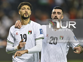 Wessam Abouli (L) of Palestine celebrates after scoring a goal during the FIFA World Cup 2026 Qualification 3rd Round group B match between...