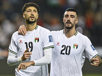 Wessam Abouli (L) of Palestine celebrates after scoring a goal during the FIFA World Cup 2026 Qualification 3rd Round group B match between...