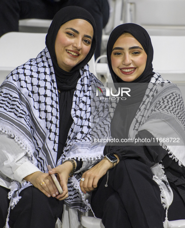 Palestine fans pose inside the stadium before the FIFA World Cup 2026 Asian Qualifiers third round group B match between Palestine and Kuwai...