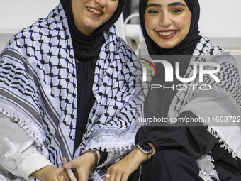 Palestine fans pose inside the stadium before the FIFA World Cup 2026 Asian Qualifiers third round group B match between Palestine and Kuwai...