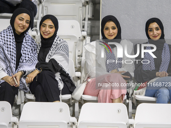 Palestine fans pose inside the stadium before the FIFA World Cup 2026 Asian Qualifiers third round group B match between Palestine and Kuwai...