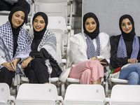 Palestine fans pose inside the stadium before the FIFA World Cup 2026 Asian Qualifiers third round group B match between Palestine and Kuwai...