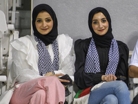 Palestine fans pose inside the stadium before the FIFA World Cup 2026 Asian Qualifiers third round group B match between Palestine and Kuwai...