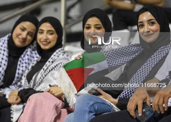 Palestine fans pose inside the stadium before the FIFA World Cup 2026 Asian Qualifiers third round group B match between Palestine and Kuwai...