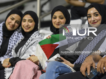 Palestine fans pose inside the stadium before the FIFA World Cup 2026 Asian Qualifiers third round group B match between Palestine and Kuwai...