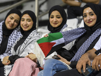 Palestine fans pose inside the stadium before the FIFA World Cup 2026 Asian Qualifiers third round group B match between Palestine and Kuwai...