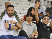 Fans of Palestine cheer during the FIFA World Cup 2026 Asian Qualifiers third round group B match between Palestine and Kuwait at Jassim Bin...