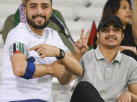 Fans of Palestine cheer during the FIFA World Cup 2026 Asian Qualifiers third round group B match between Palestine and Kuwait at Jassim Bin...