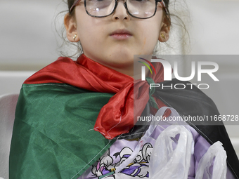 A fan of Palestine poses inside the stadium before the FIFA World Cup 2026 Asian Qualifiers third round group B match between Palestine and...