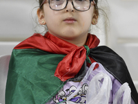 A fan of Palestine poses inside the stadium before the FIFA World Cup 2026 Asian Qualifiers third round group B match between Palestine and...