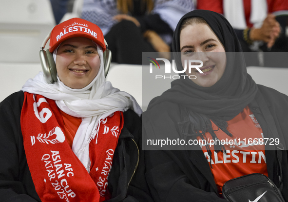 Palestine fans pose inside the stadium before the FIFA World Cup 2026 Asian Qualifiers third round group B match between Palestine and Kuwai...