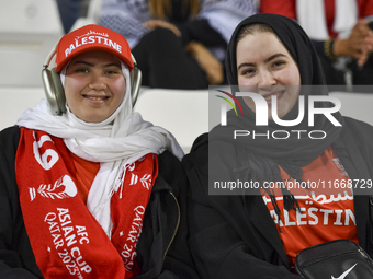 Palestine fans pose inside the stadium before the FIFA World Cup 2026 Asian Qualifiers third round group B match between Palestine and Kuwai...