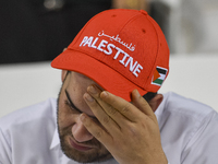 A fan of Palestine poses inside the stadium before the FIFA World Cup 2026 Asian Qualifiers third round group B match between Palestine and...