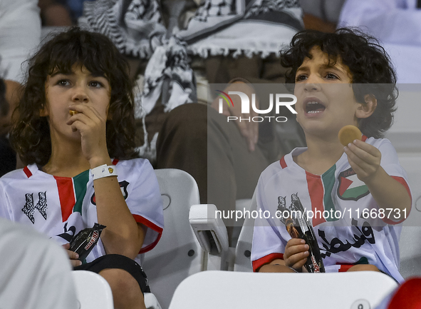 Fans of Palestine cheer during the FIFA World Cup 2026 Asian Qualifiers third round group B match between Palestine and Kuwait at Jassim Bin...