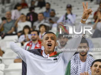 Evacuees from Gaza cheer for the Palestine national team during the FIFA World Cup 2026 Asian Qualifiers third round group B match between P...