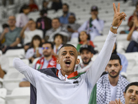 Evacuees from Gaza cheer for the Palestine national team during the FIFA World Cup 2026 Asian Qualifiers third round group B match between P...