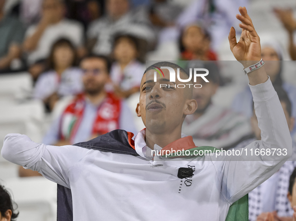 Evacuees from Gaza cheer for the Palestine national team during the FIFA World Cup 2026 Asian Qualifiers third round group B match between P...