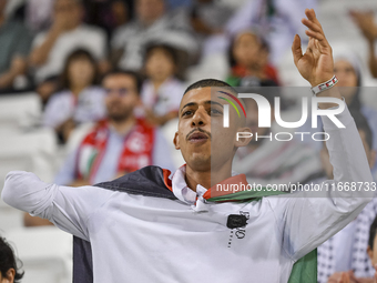 Evacuees from Gaza cheer for the Palestine national team during the FIFA World Cup 2026 Asian Qualifiers third round group B match between P...