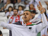 Evacuees from Gaza cheer for the Palestine national team during the FIFA World Cup 2026 Asian Qualifiers third round group B match between P...