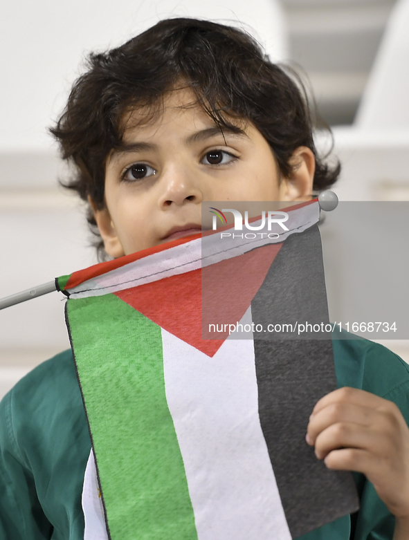 A fan of Palestine cheers during the FIFA World Cup 2026 Asian Qualifiers third round group B match between Palestine and Kuwait at Jassim B...