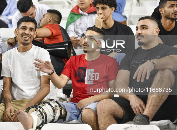 Evacuees from Gaza cheer for the Palestine national team during the FIFA World Cup 2026 Asian Qualifiers third round group B match between P...