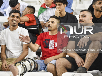 Evacuees from Gaza cheer for the Palestine national team during the FIFA World Cup 2026 Asian Qualifiers third round group B match between P...