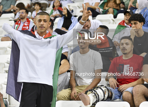 Evacuees from Gaza cheer for the Palestine national team during the FIFA World Cup 2026 Asian Qualifiers third round group B match between P...