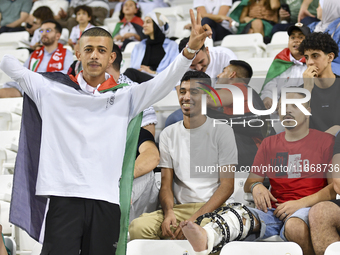 Evacuees from Gaza cheer for the Palestine national team during the FIFA World Cup 2026 Asian Qualifiers third round group B match between P...