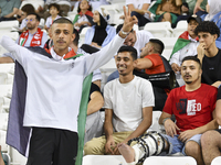 Evacuees from Gaza cheer for the Palestine national team during the FIFA World Cup 2026 Asian Qualifiers third round group B match between P...