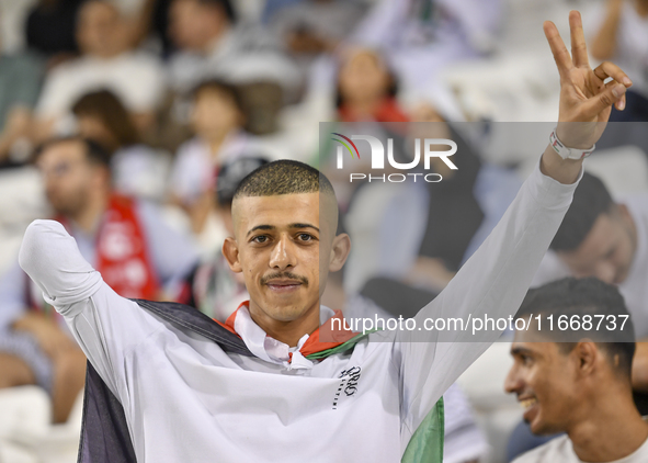 Evacuees from Gaza cheer for the Palestine national team during the FIFA World Cup 2026 Asian Qualifiers third round group B match between P...