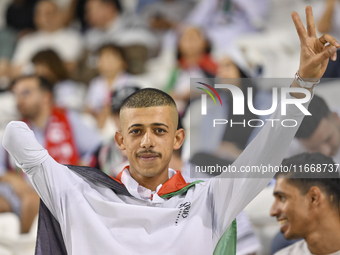 Evacuees from Gaza cheer for the Palestine national team during the FIFA World Cup 2026 Asian Qualifiers third round group B match between P...