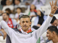 Evacuees from Gaza cheer for the Palestine national team during the FIFA World Cup 2026 Asian Qualifiers third round group B match between P...