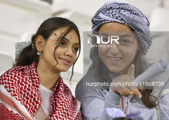 Evacuees from Gaza cheer for the Palestine national team during the FIFA World Cup 2026 Asian Qualifiers third round group B match between P...