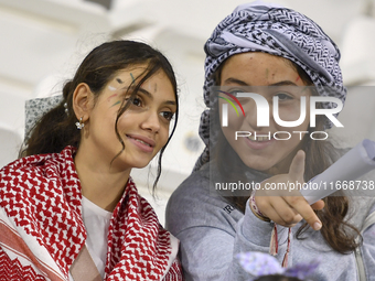 Evacuees from Gaza cheer for the Palestine national team during the FIFA World Cup 2026 Asian Qualifiers third round group B match between P...