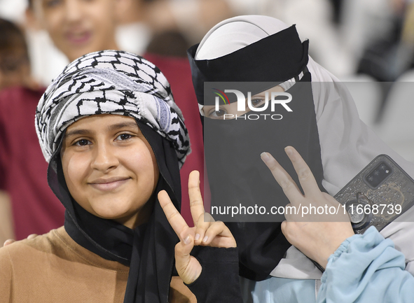 Evacuees from Gaza cheer for the Palestine national team during the FIFA World Cup 2026 Asian Qualifiers third round group B match between P...