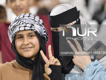 Evacuees from Gaza cheer for the Palestine national team during the FIFA World Cup 2026 Asian Qualifiers third round group B match between P...