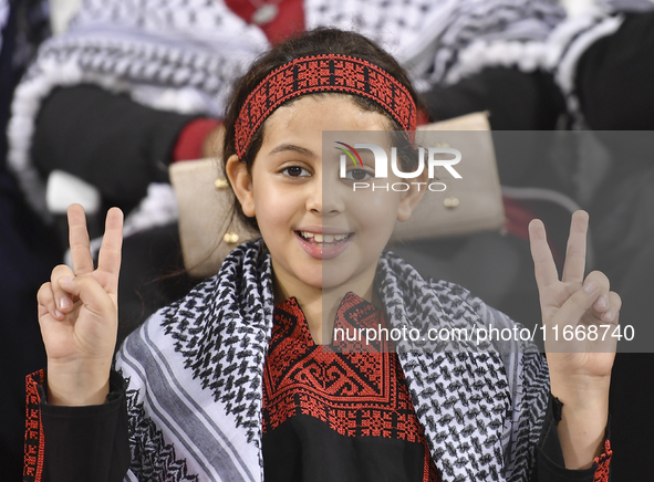 Evacuees from Gaza cheer for the Palestine national team during the FIFA World Cup 2026 Asian Qualifiers third round group B match between P...