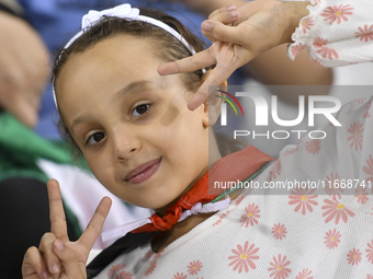 Evacuees from Gaza cheer for the Palestine national team during the FIFA World Cup 2026 Asian Qualifiers third round group B match between P...