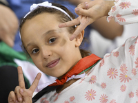 Evacuees from Gaza cheer for the Palestine national team during the FIFA World Cup 2026 Asian Qualifiers third round group B match between P...