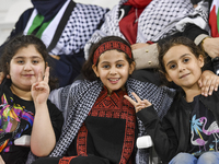 Evacuees from Gaza cheer for the Palestine national team during the FIFA World Cup 2026 Asian Qualifiers third round group B match between P...