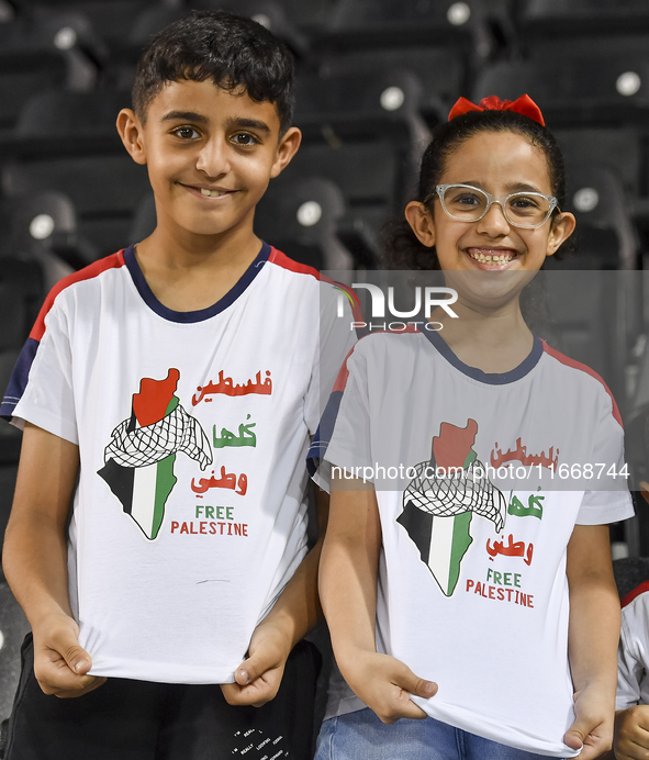 Fans of Palestine cheer during the FIFA World Cup 2026 Asian Qualifiers third round group B match between Palestine and Kuwait at Jassim Bin...