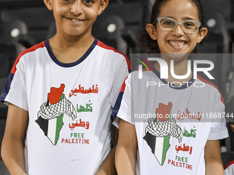 Fans of Palestine cheer during the FIFA World Cup 2026 Asian Qualifiers third round group B match between Palestine and Kuwait at Jassim Bin...