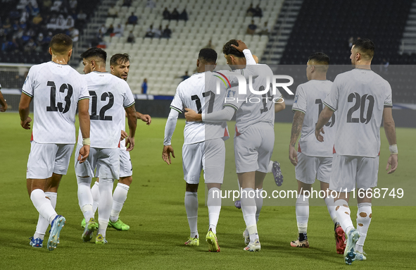 Wessam Abouli (3-R) of Palestine celebrates with his teammates after scoring a goal during the FIFA World Cup 2026 Qualification 3rd Round g...