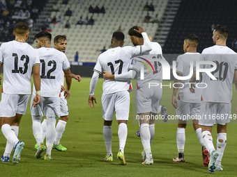 Wessam Abouli (3-R) of Palestine celebrates with his teammates after scoring a goal during the FIFA World Cup 2026 Qualification 3rd Round g...