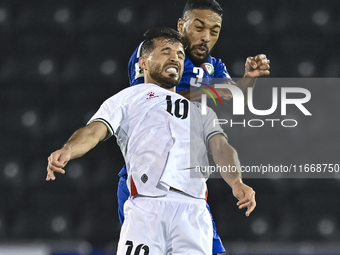 Mahmoud Abuwarda of Palestine battles for the ball with Meshari Alenezi of Kuwait during the FIFA World Cup 2026 Qualification 3rd Round gro...