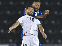 Mahmoud Abuwarda of Palestine battles for the ball with Meshari Alenezi of Kuwait during the FIFA World Cup 2026 Qualification 3rd Round gro...