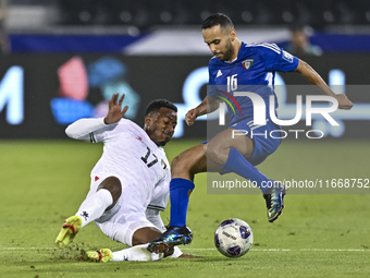 Mousa Farawi of Palestine battles for the ball with Moaath Alenezi of Kuwait during the FIFA World Cup 2026 Qualification 3rd Round group B...