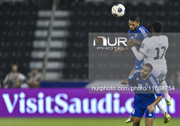 Mousa Farawi (C) of Palestine battles for the ball with Fahad Alhajeri of Kuwait during the FIFA World Cup 2026 Qualification 3rd Round grou...